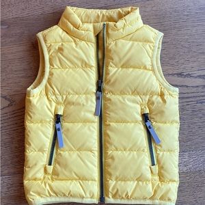 Adorable yellow puffer vest by Hanna Andersson